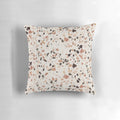 Terrazzo textured decorative pillow in earthy tones