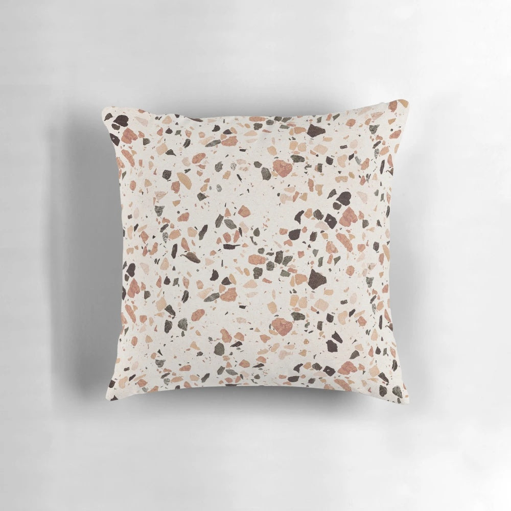 Terrazzo textured decorative pillow in earthy tones