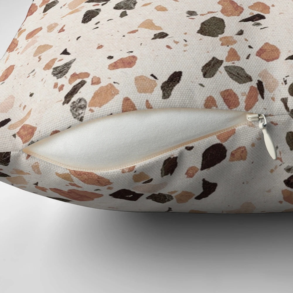 Terrazzo textured decorative pillow in earthy tones