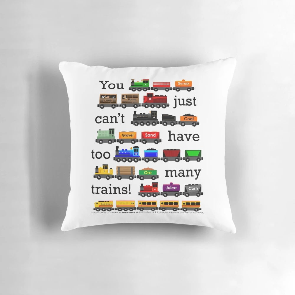 A black pillow with white text that reads "Too Many Trains", featuring a train-themed design.