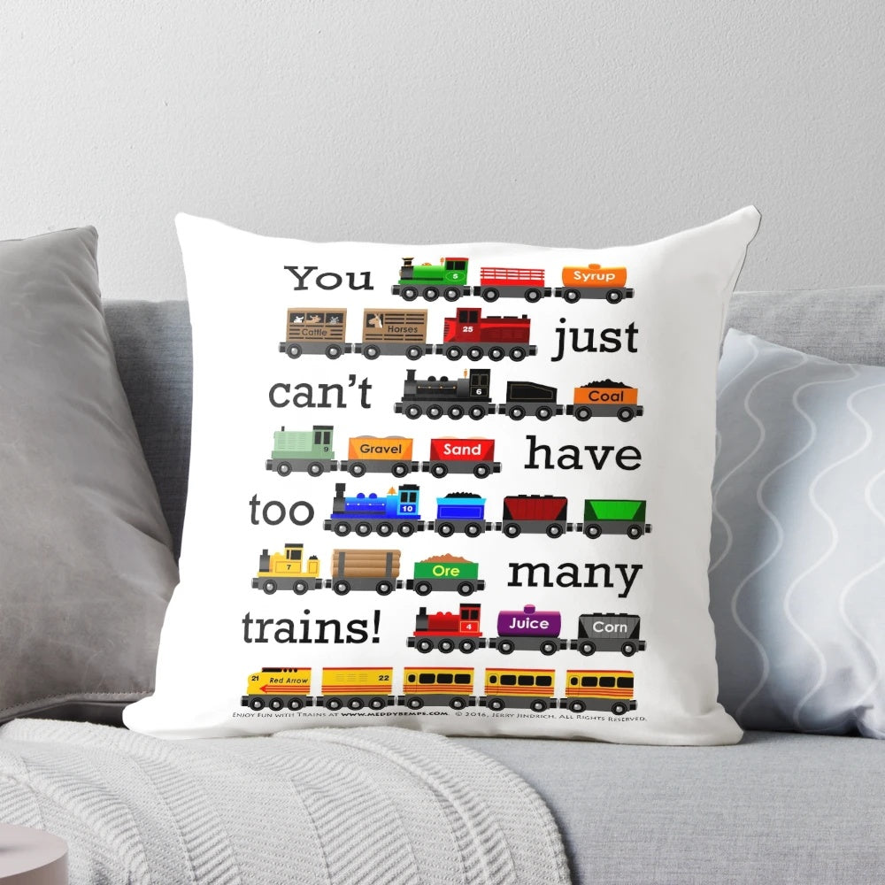 A black pillow with white text that reads "Too Many Trains", featuring a train-themed design.