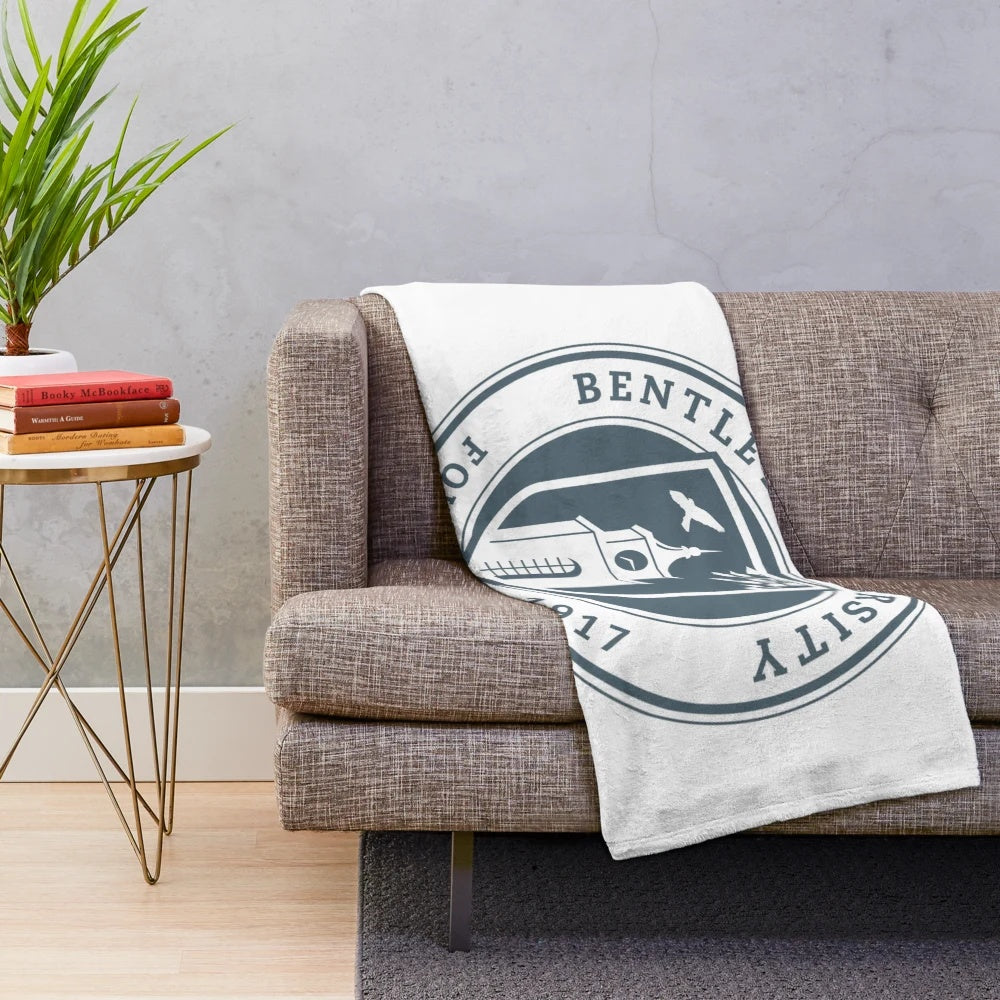 Plush university-themed blanket with institutional logo