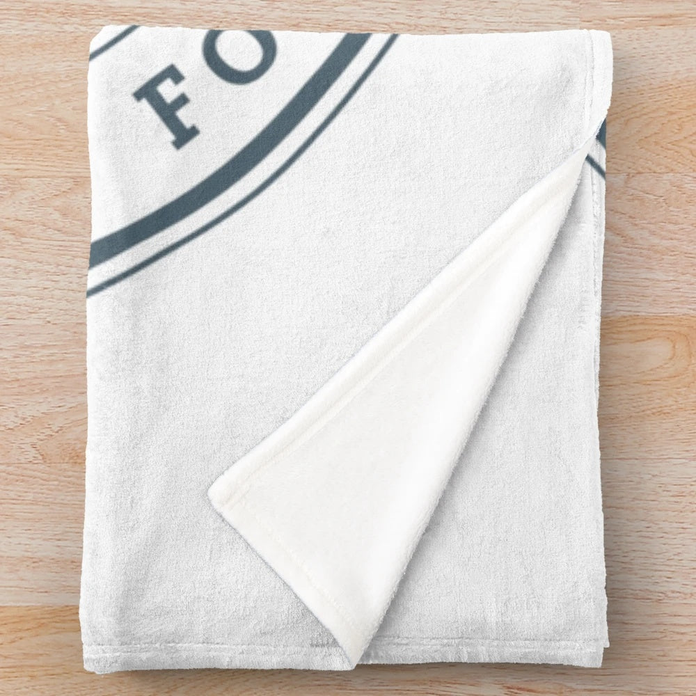 Plush university-themed blanket with institutional logo