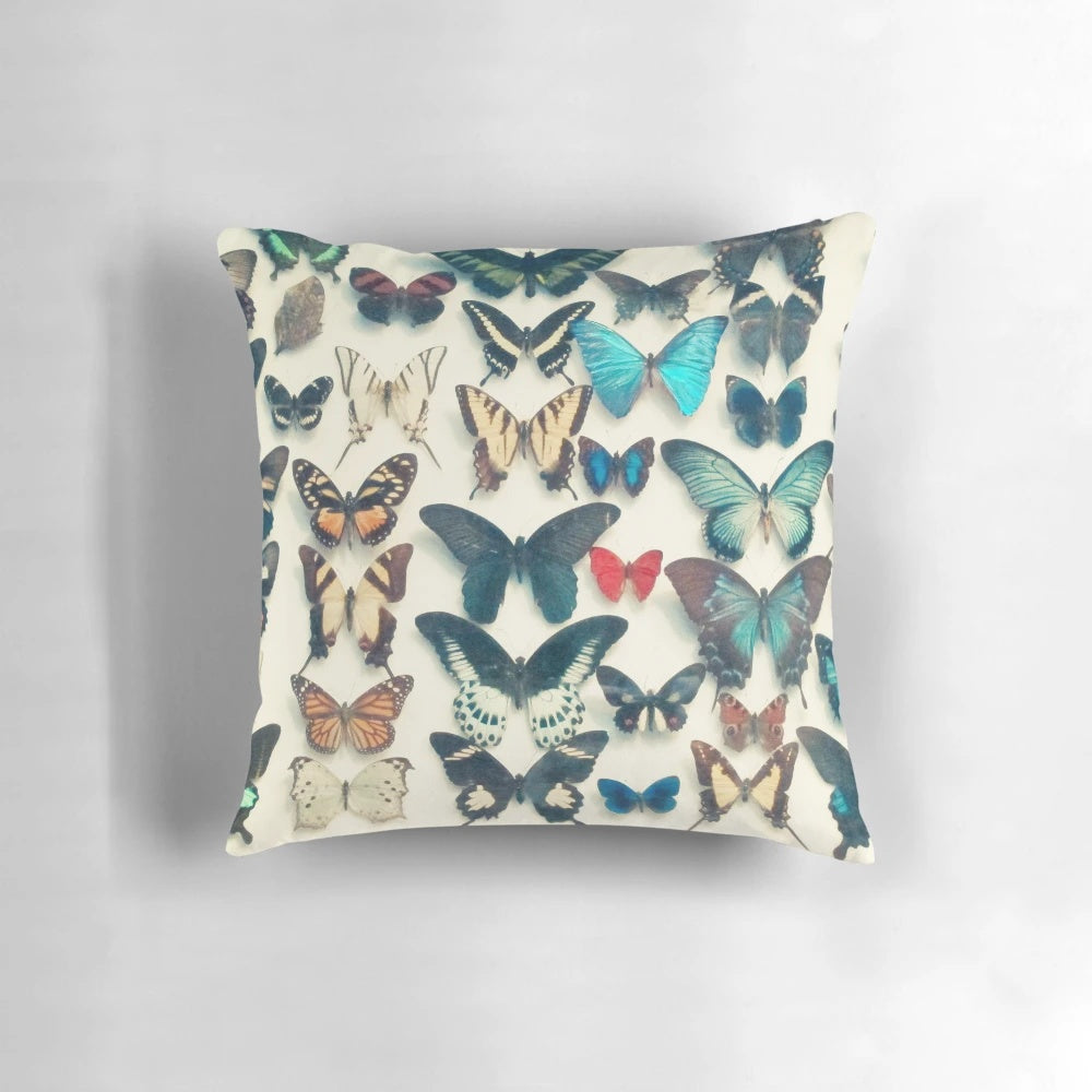Colorful butterfly wings-inspired decorative pillow with a bold, textured design