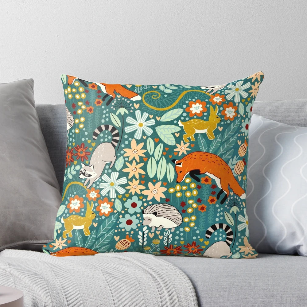 Decorative throw pillow featuring a whimsical woodland pattern with forest animals and floral elements, digitally illustrated in a hand-drawn style.