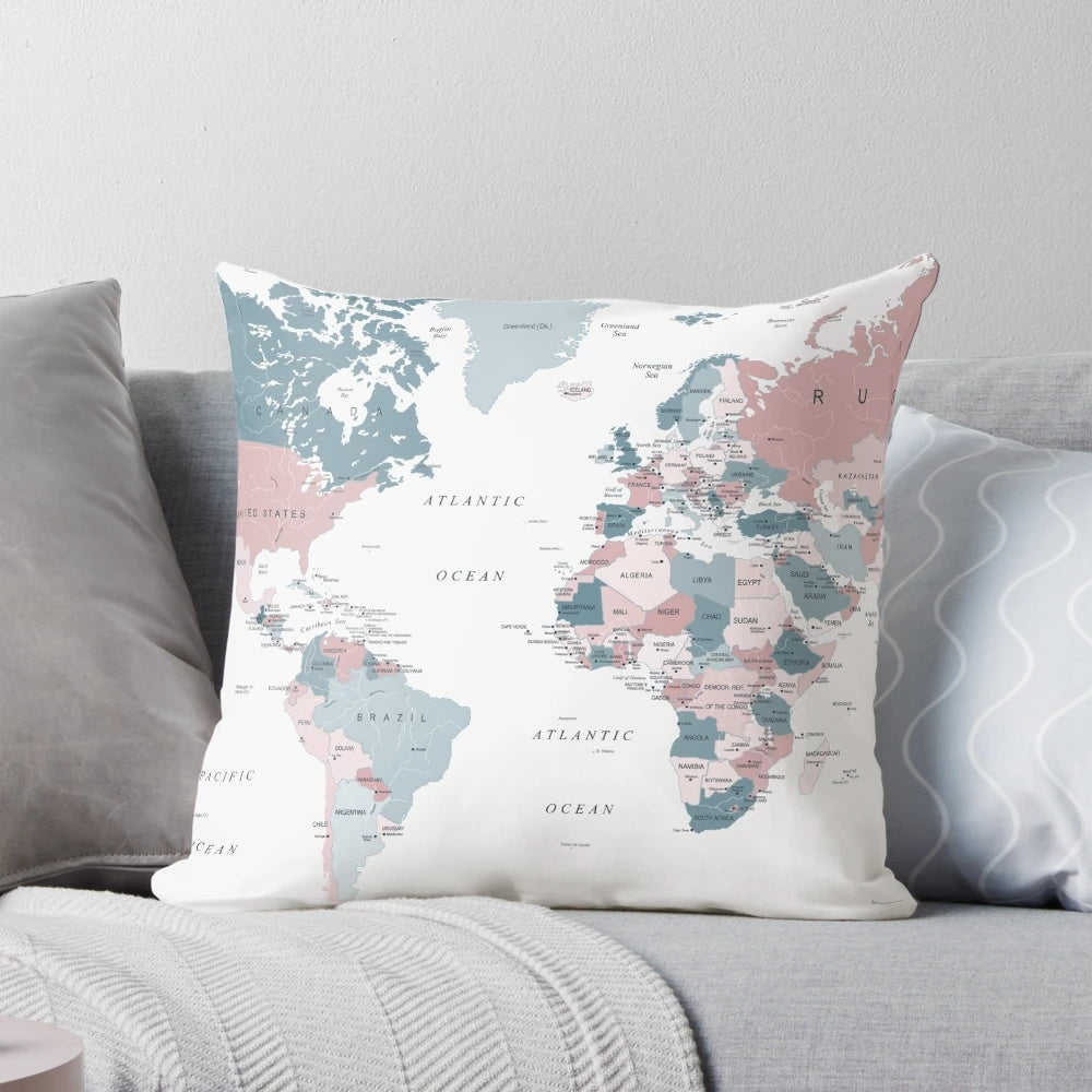 A decorative throw pillow featuring a detailed map of the world in soft pink and blue colors.