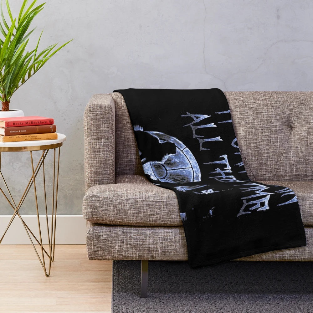 Soft, cozy blue plush blanket with crow motif design