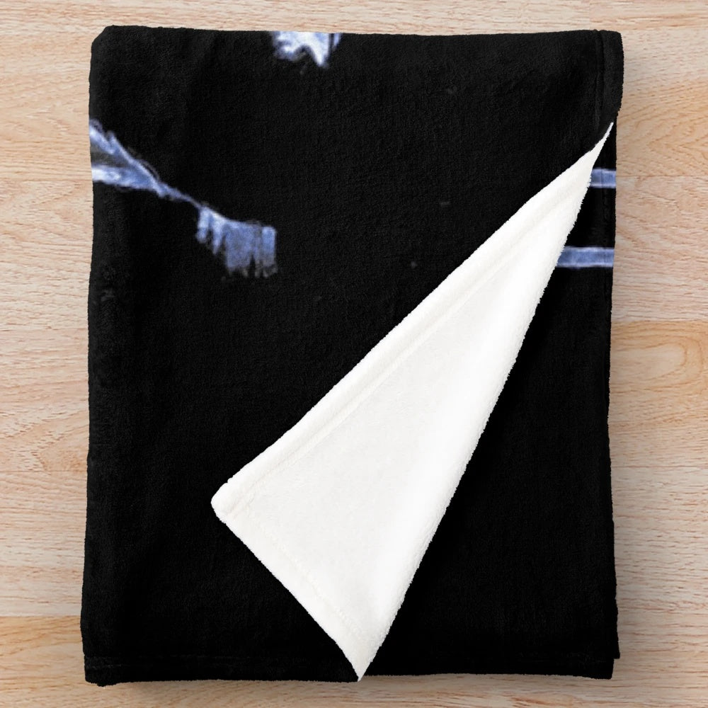Soft, cozy blue plush blanket with crow motif design