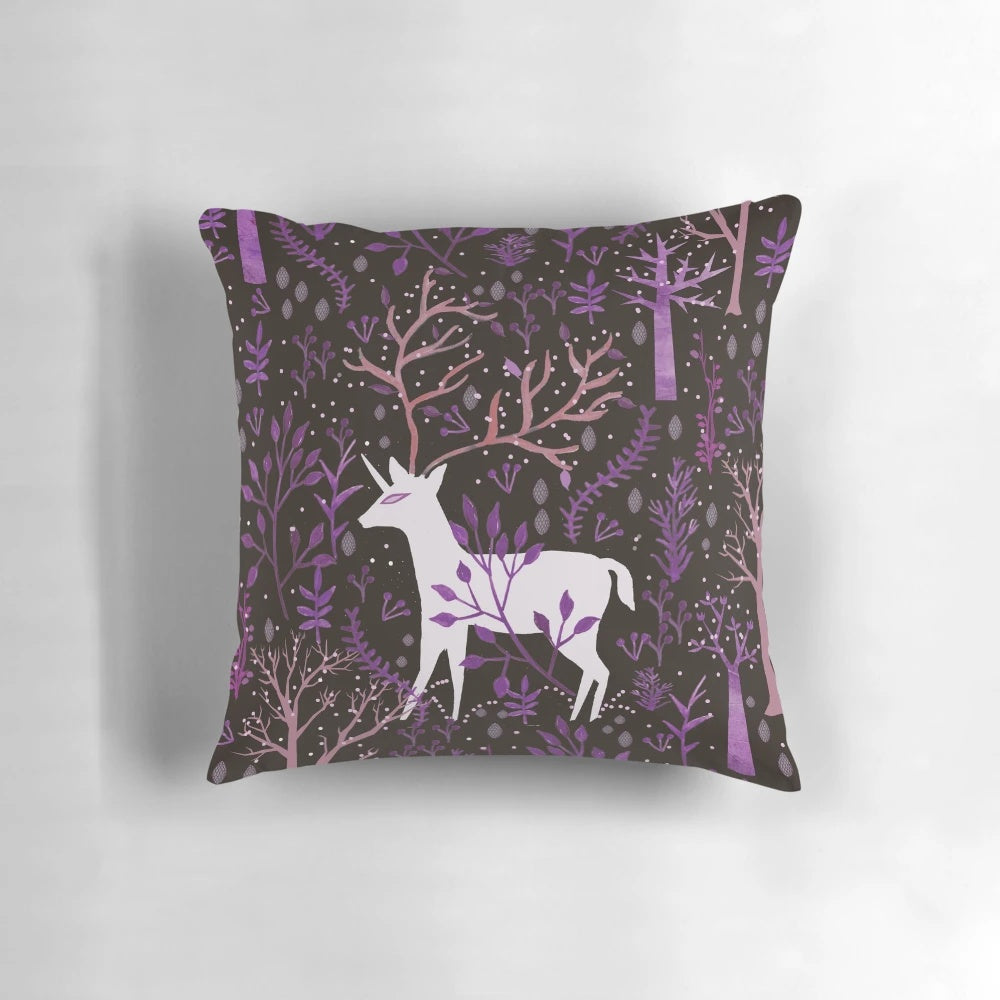 Whimsical deericorn illustration in a purple pillow design