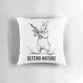 Rabbit-shaped pillow with the text "Defend Nature" on a forest background