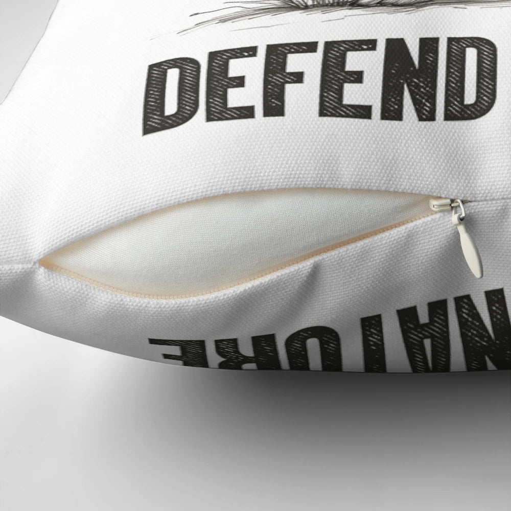 Rabbit-shaped pillow with the text "Defend Nature" on a forest background