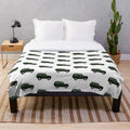 Defender-inspired green plush blanket featuring a classic off-road vehicle design
