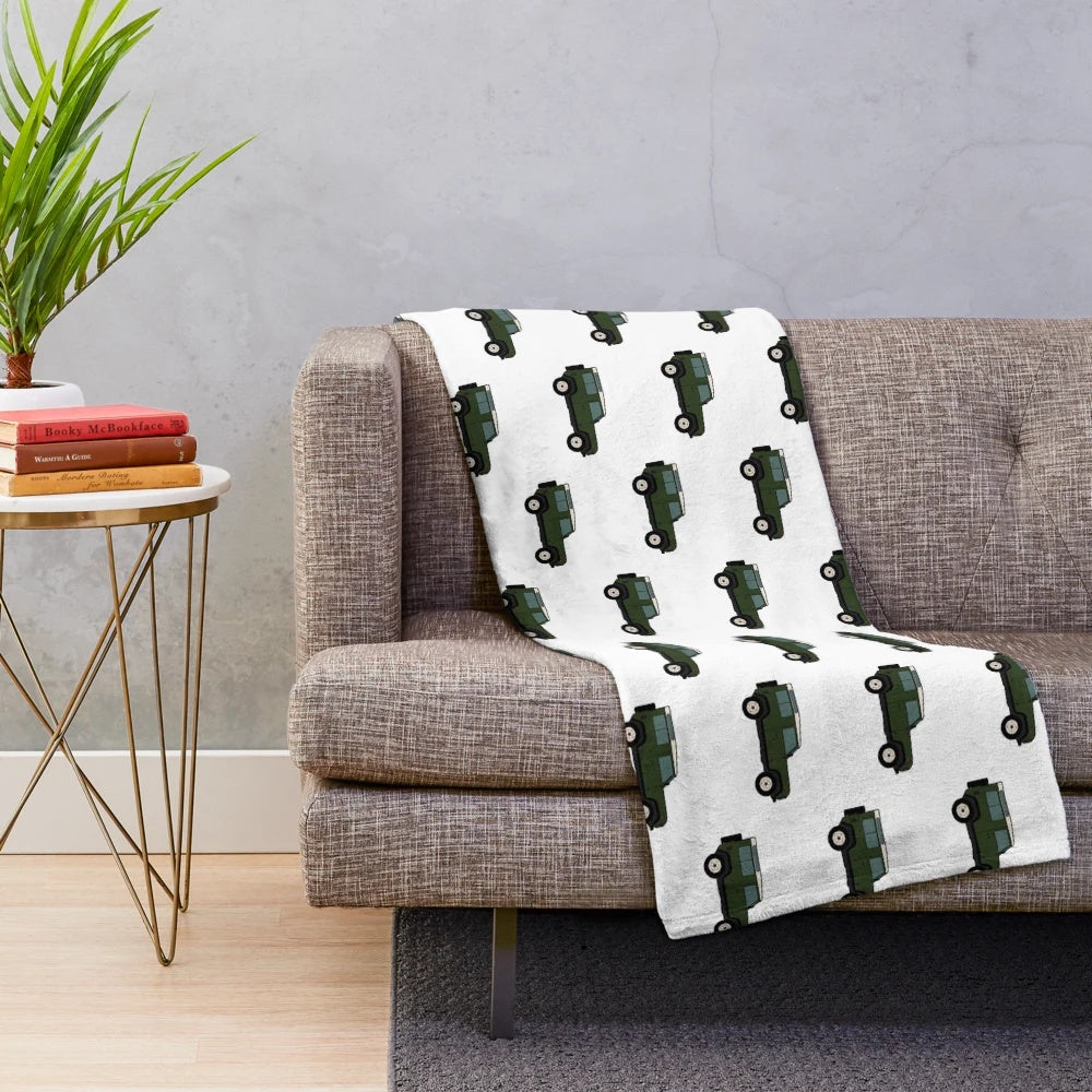 Defender-inspired green plush blanket featuring a classic off-road vehicle design