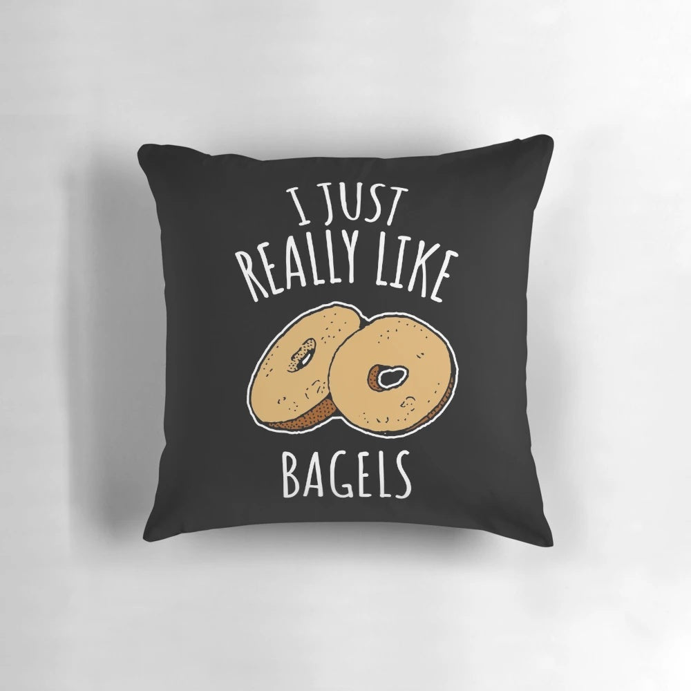 A fluffy, decorative pillow featuring a vibrant print of delicious bagels, perfect for food-loving homes.