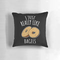 A fluffy, decorative pillow featuring a vibrant print of delicious bagels, perfect for food-loving homes.