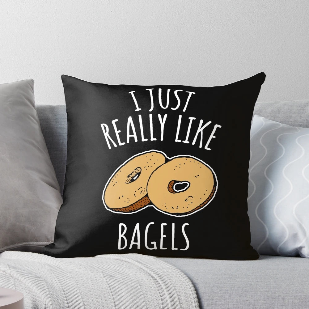 A fluffy, decorative pillow featuring a vibrant print of delicious bagels, perfect for food-loving homes.