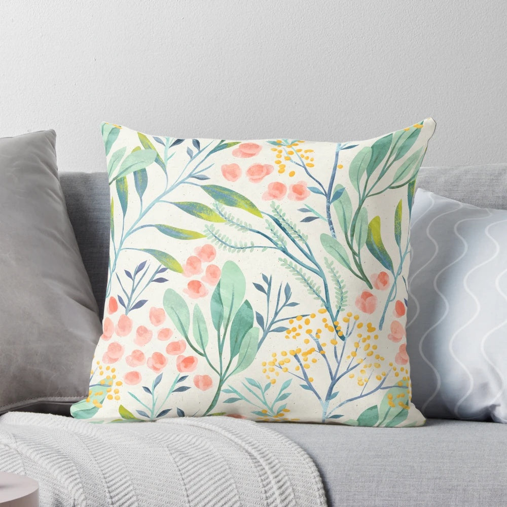 Botanical garden-inspired floral pillow with a delicate watercolor design