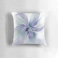 Periwinkle blue floral pillow with delicate, translucent petals for a serene, natural home accent.