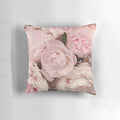 Close-up of soft, pink peony flowers printed on a decorative pillow