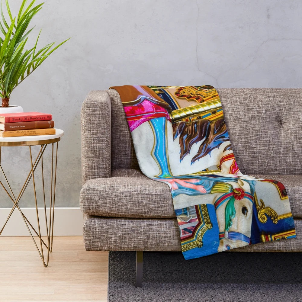 Colorful carousel horses design on a soft, plush blanket