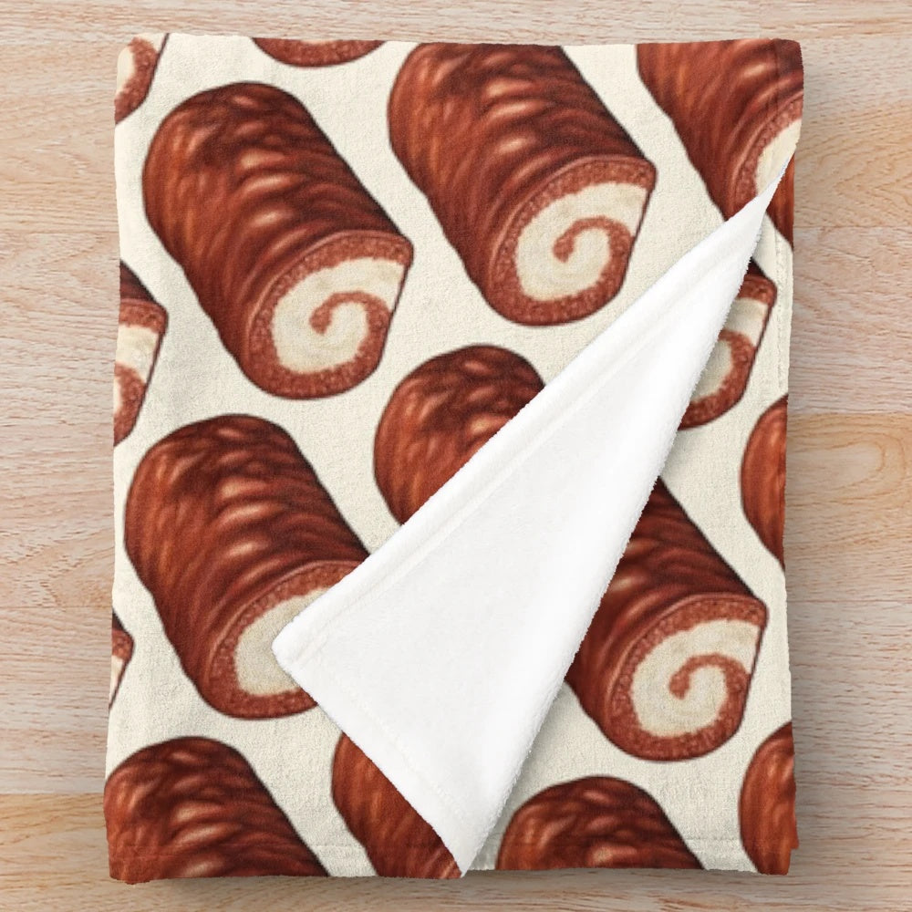 Soft and cozy plush blanket featuring a chocolate swiss roll cake pattern