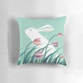 Soft and cozy pillow featuring a resting rabbit against a backdrop of floral and nature-inspired patterns