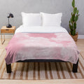 Soft and luxurious plush blanket with a whimsical pink cloud and sparkle design