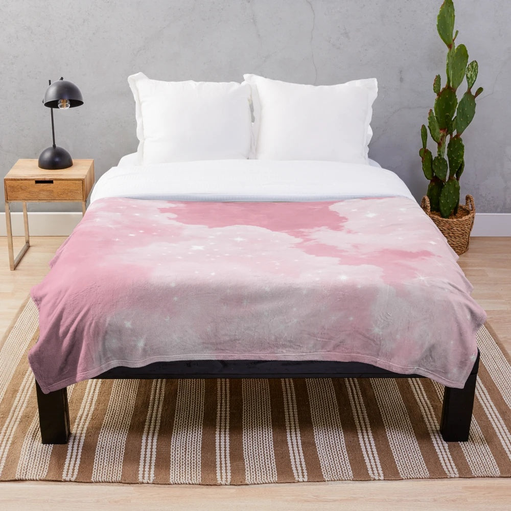 Soft and luxurious plush blanket with a whimsical pink cloud and sparkle design