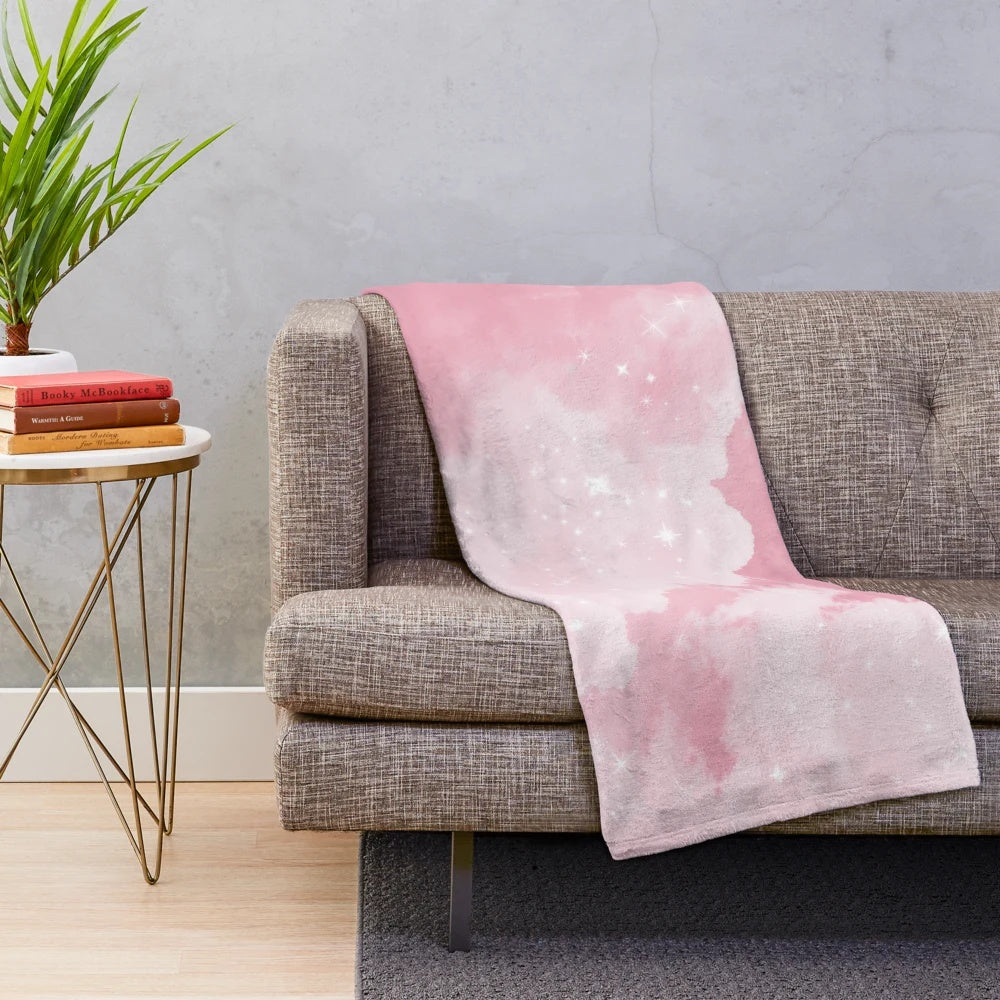 Soft and luxurious plush blanket with a whimsical pink cloud and sparkle design