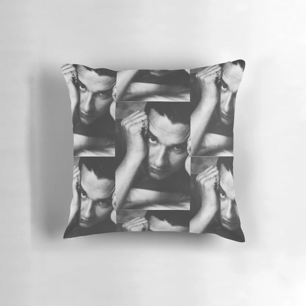 Black and white image of Depeche Mode's lead singer Dave Gahan on a pillow
