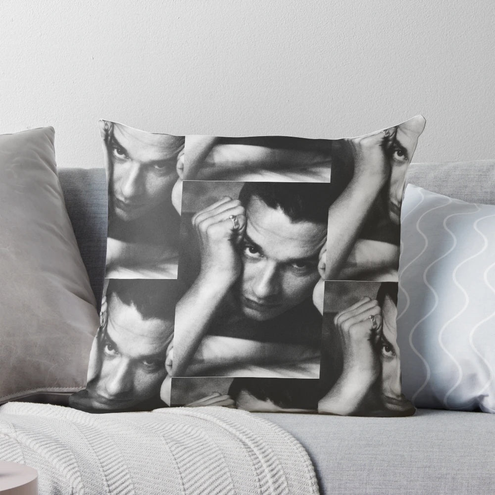 Black and white image of Depeche Mode's lead singer Dave Gahan on a pillow