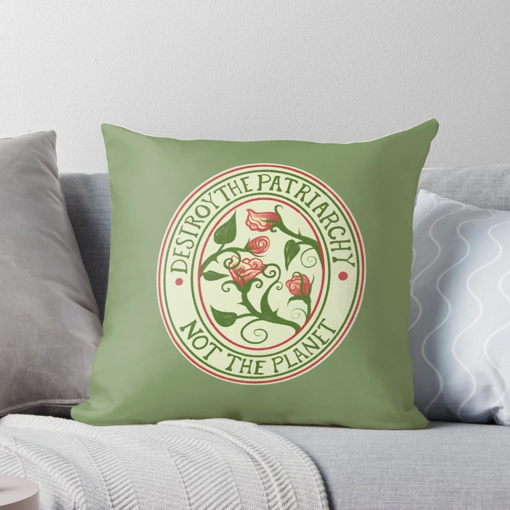 Vintage-style pillow with text "Destroy the Patriarchy, Not the Planet" and floral design.