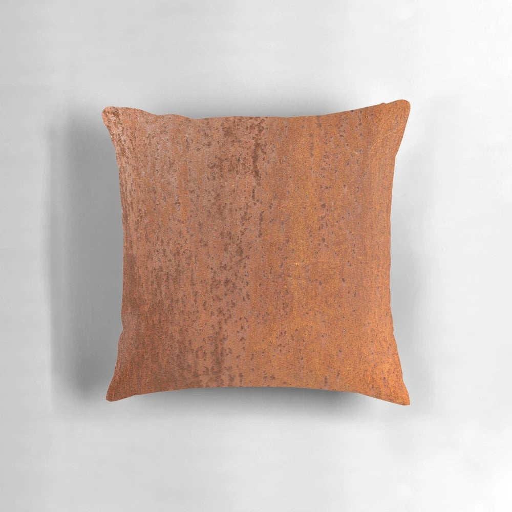 Detailed closeup of a slightly rough, weathered and rusted orange-red metal sheet texture, perfect for a pillow design.