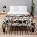 Detailed plush blanket with image of norman knights and archers from the Bayeux Tapestry