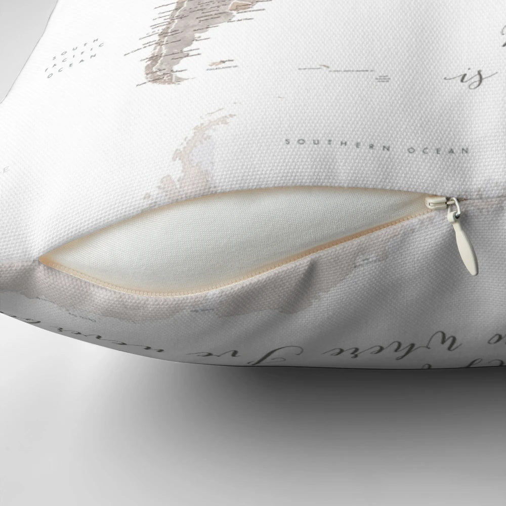 Detailed taupe world map illustration on a throw pillow
