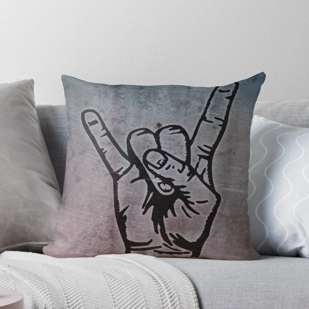 A decorative pillow with a stylized devil hand design in the shape of a french fry fork, featuring a pop art inspired graffiti-style pattern.