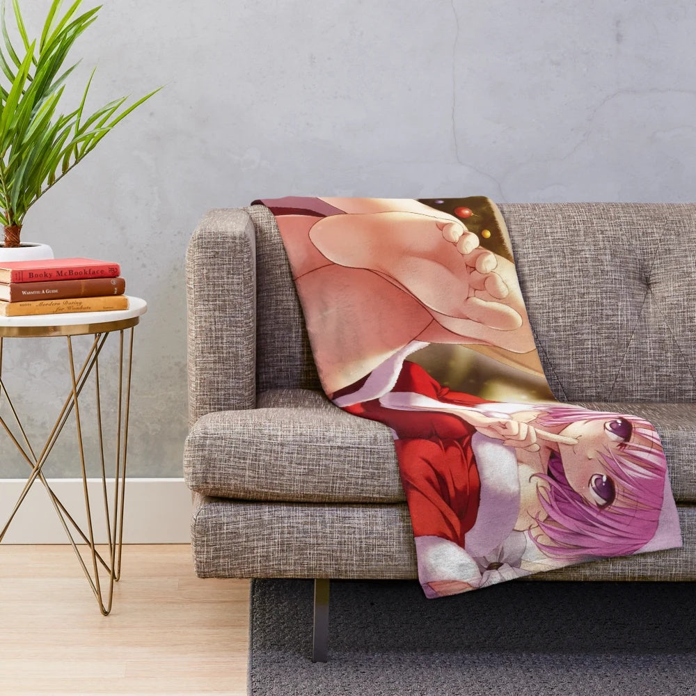 Momo Deviluke from To Love Ru in a Santa outfit on a plush blanket