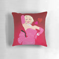A plush pillow adorned with diamond-like patterns, creating a glamorous and eye-catching addition to your living space.
