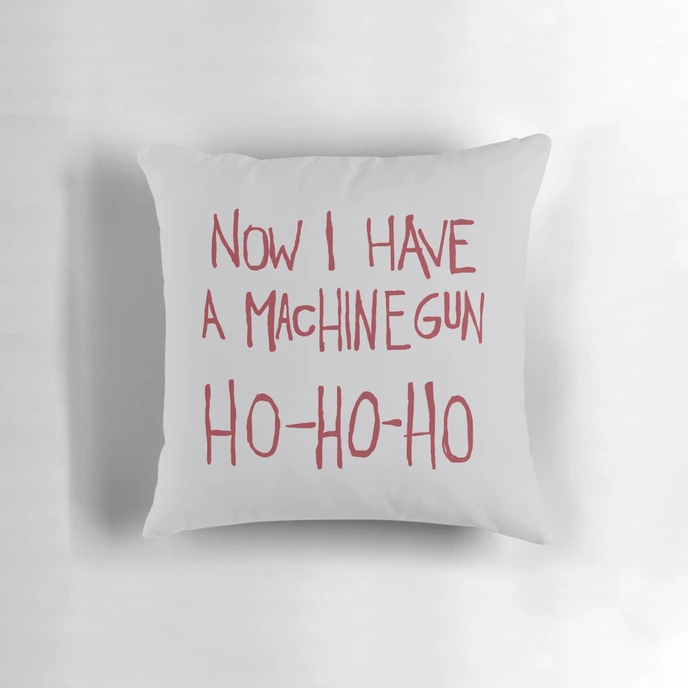 Die Hard-themed Christmas pillow featuring Bruce Willis' iconic "Ho Ho Ho" quote