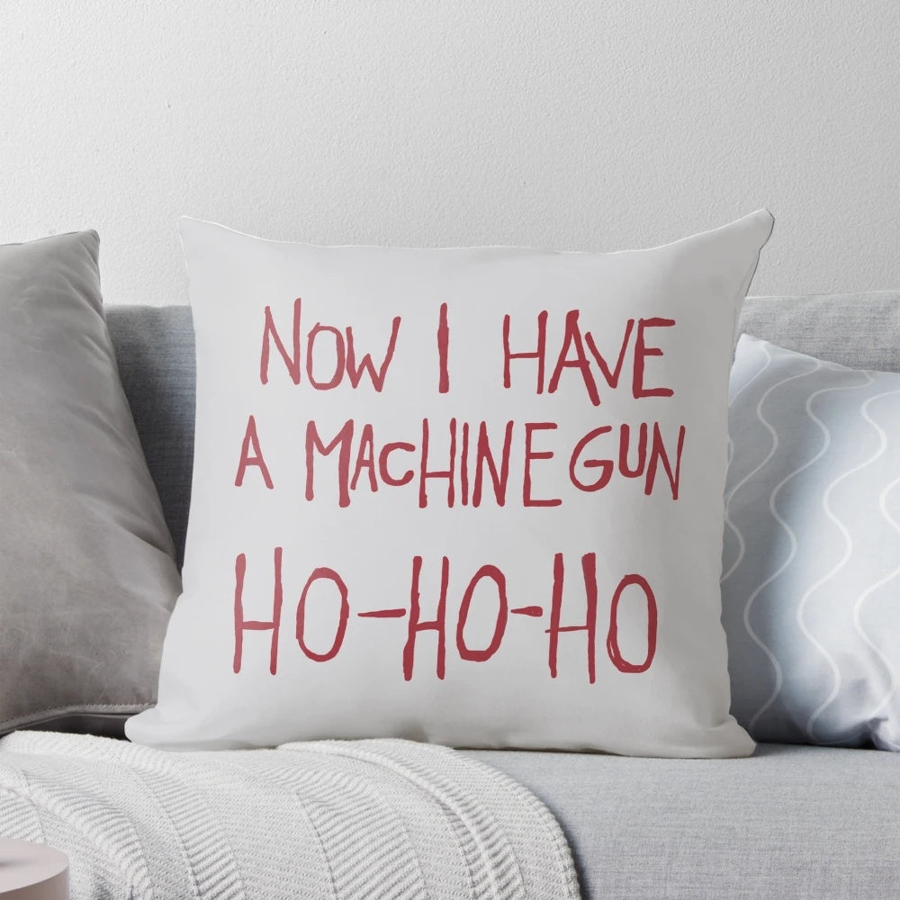Die Hard-themed Christmas pillow featuring Bruce Willis' iconic "Ho Ho Ho" quote
