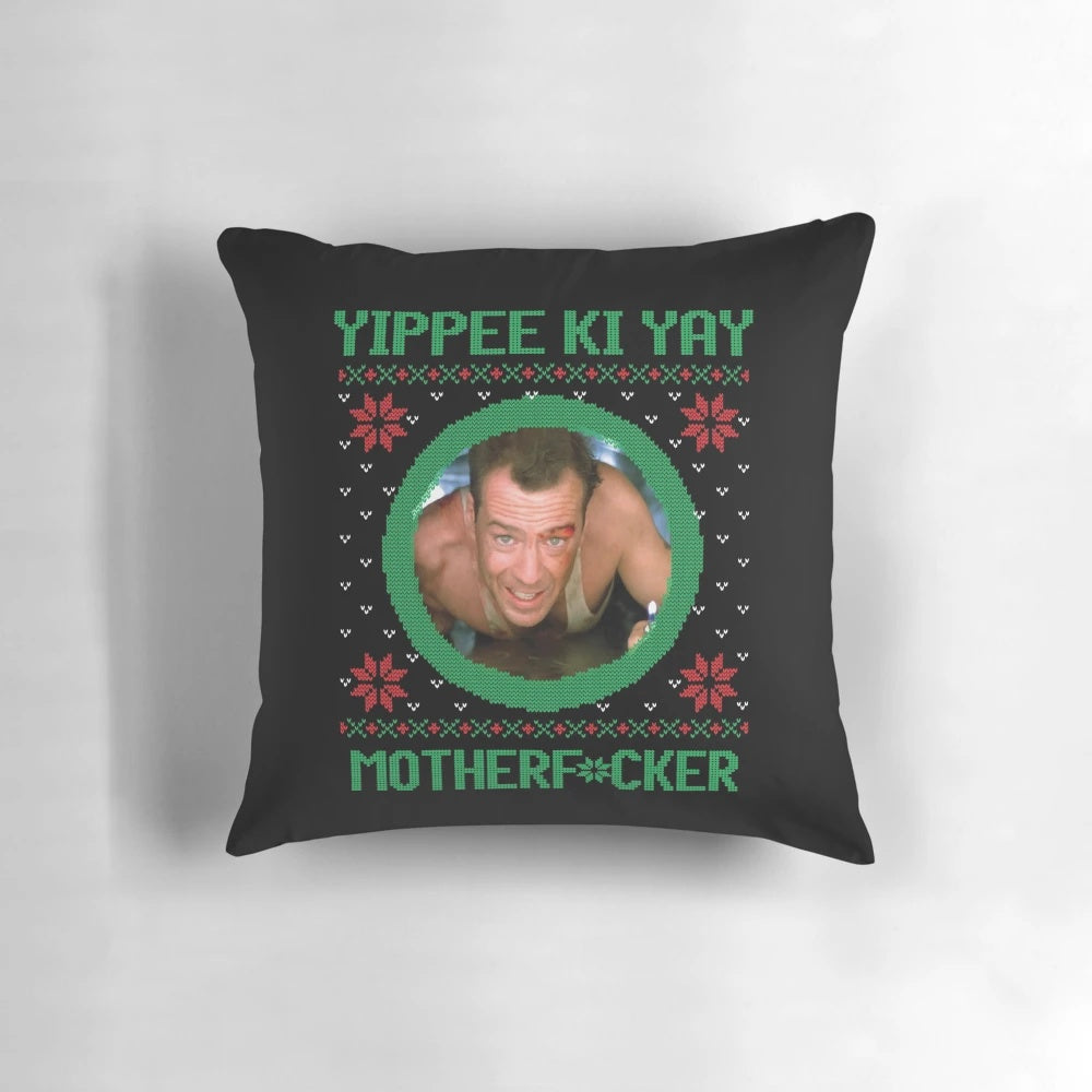 A plush pillow featuring the iconic "Yippee Ki Yay, Motherf*cker!" quote from the classic Christmas action movie, Die Hard.