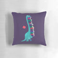 A soft, plush pillow featuring a dinosaur and book design, perfect for kids' rooms.