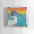 Colorful and expressive painting of a dinosaur's hips and an Australian ibis on a soft pillow.