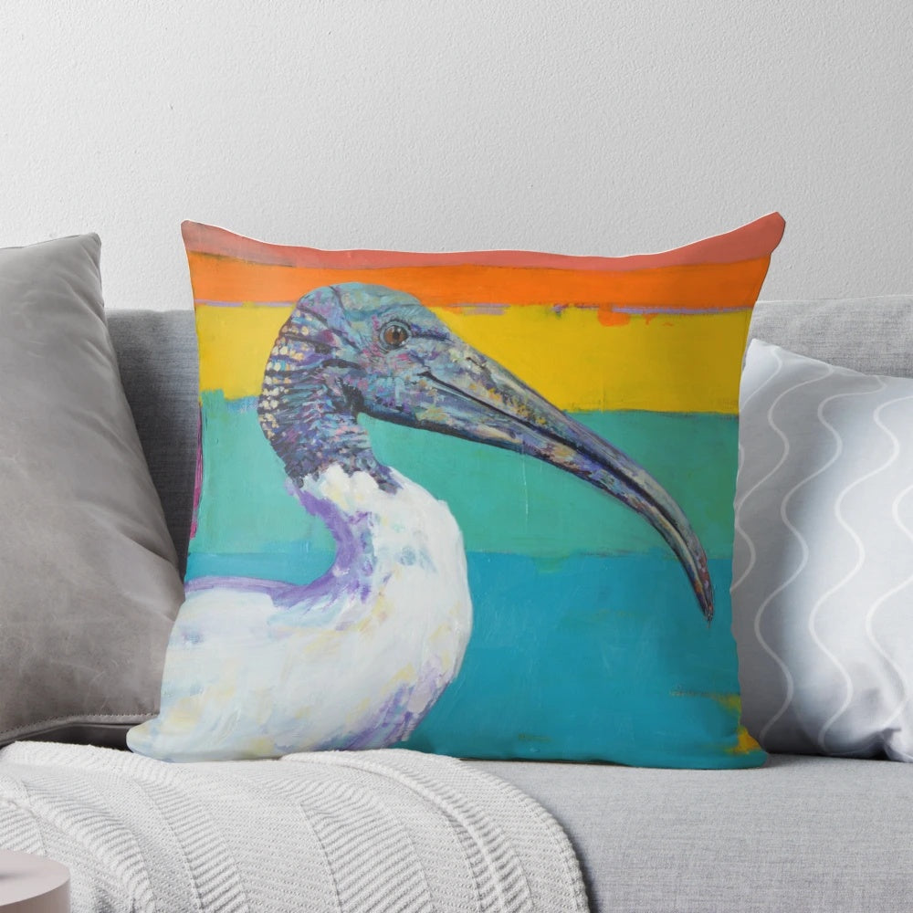 Colorful and expressive painting of a dinosaur's hips and an Australian ibis on a soft pillow.