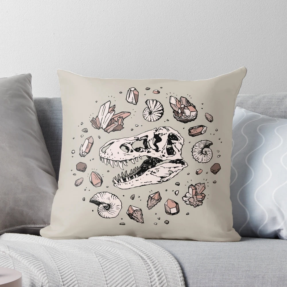 Pillow featuring a hand-drawn illustration of a dinosaur skull fossil, including a tyrannosaurus rex bone structure and rose quartz mineral.