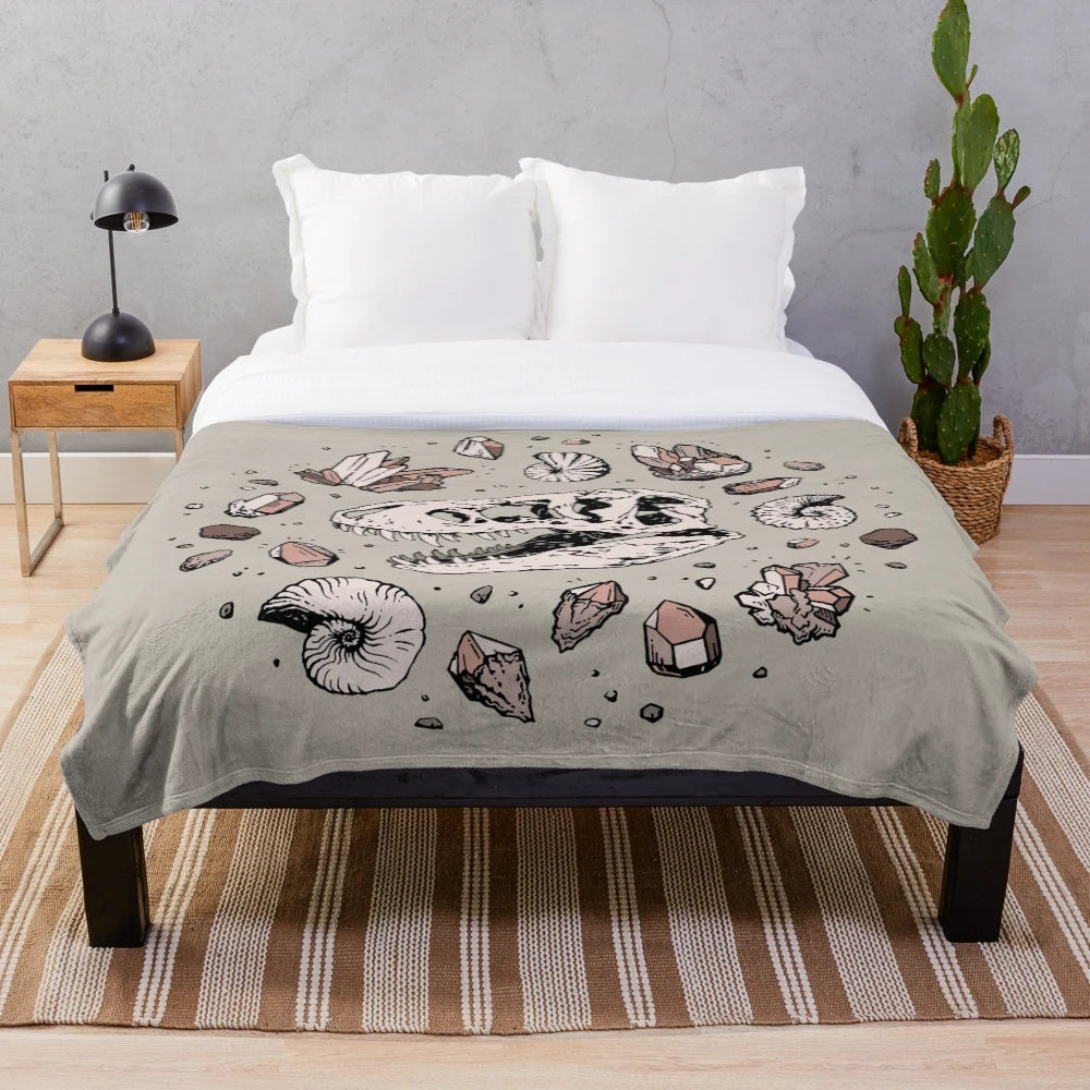 Dinosaur skull fossil art plush blanket with rose quartz mineral design
