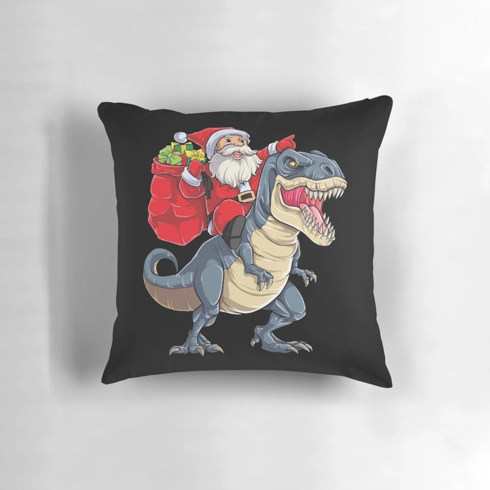 Santa Claus riding a T-Rex dinosaur on a Christmas-themed pillow