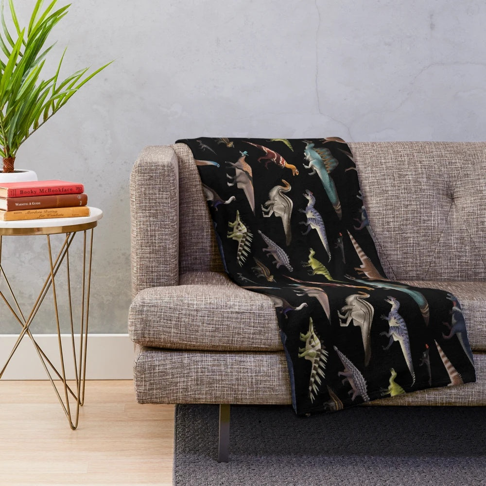 Cozy dinosaur-themed plush blanket featuring popular prehistoric creatures