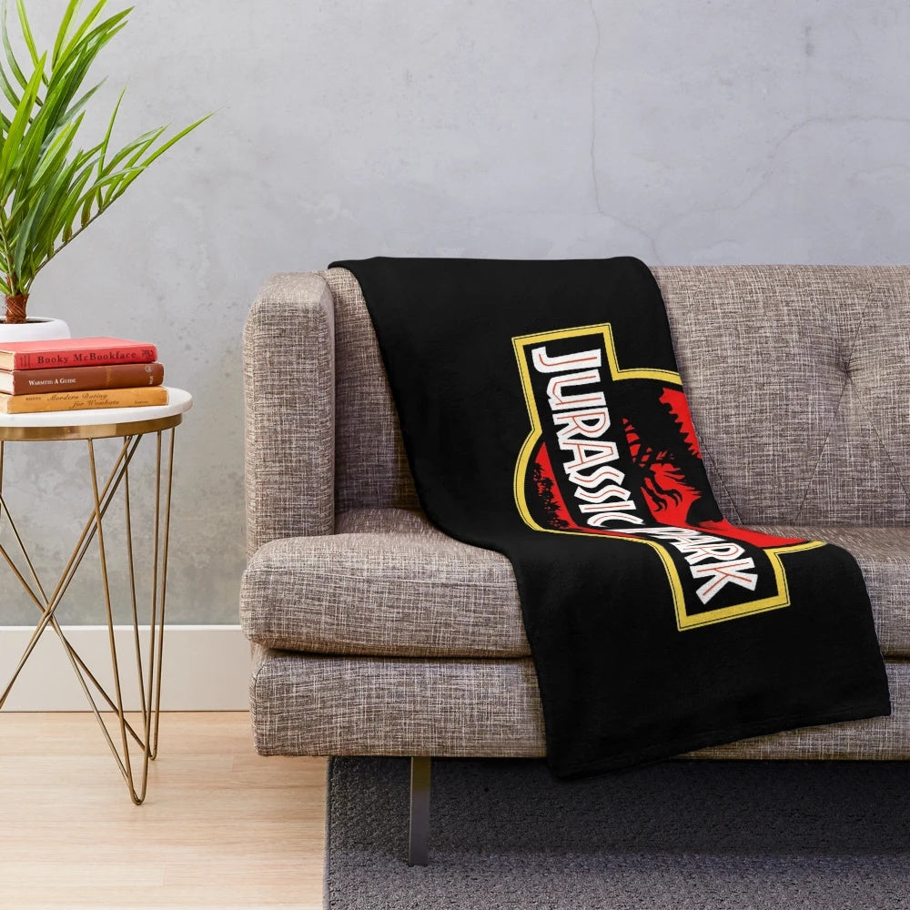 Jurassic Park themed plush blanket with dinosaur design