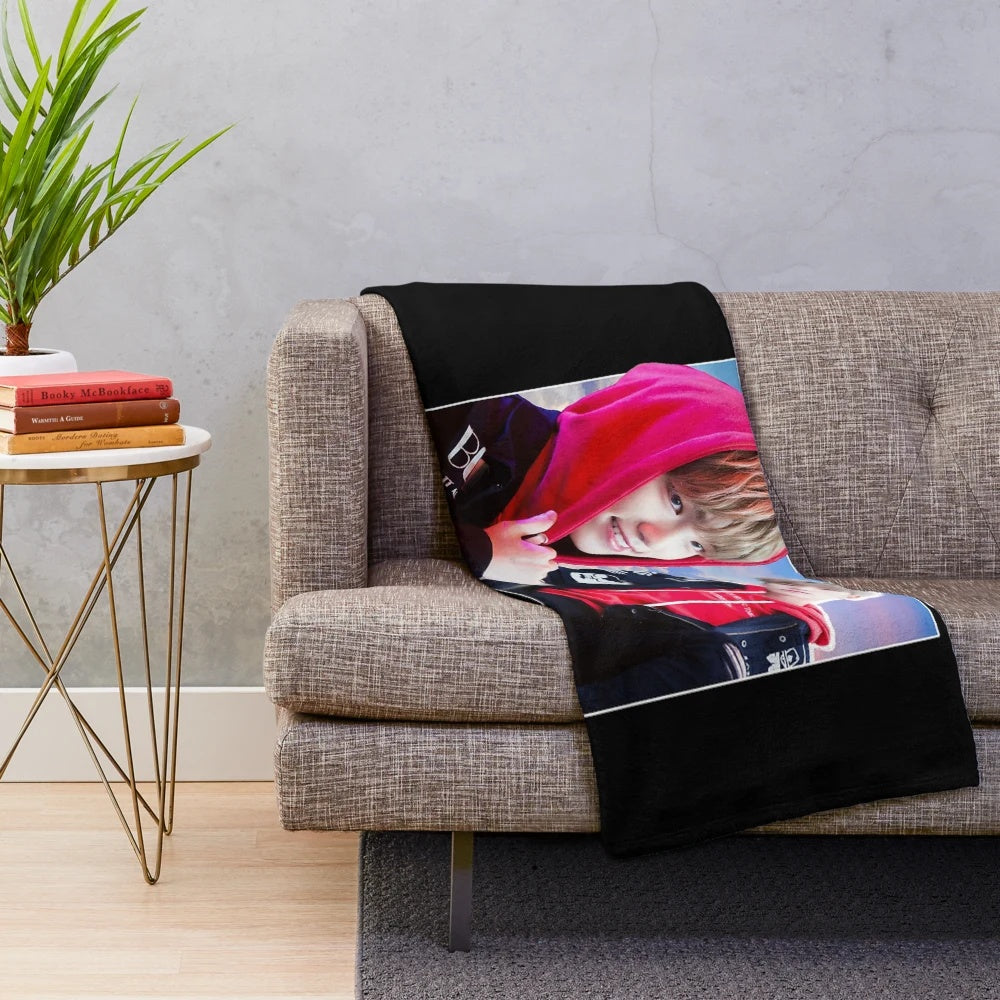 Dinosaur-themed plush blanket with Seventeen kpop group logo